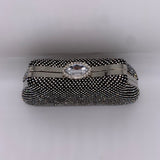 Gold fabric white stone clutch bag.